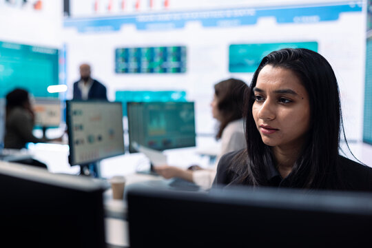 Business analyst does a presentation with project updates on pc, ensuring organizational success. Employee allocating resources according to the market needs for growth in office.