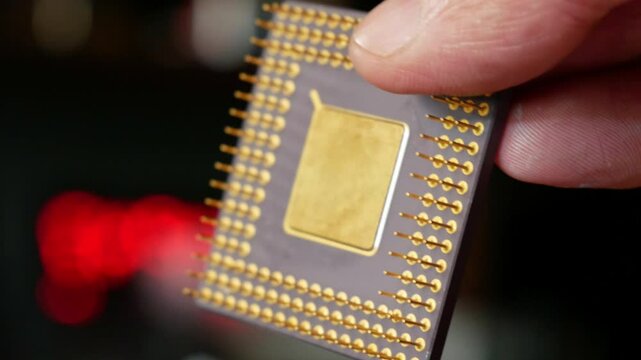 Close-up of a computer microprocessor in hands
