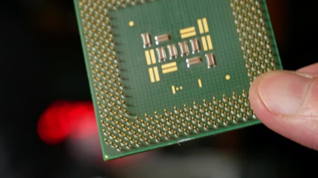 Close-up of a computer microprocessor in hands