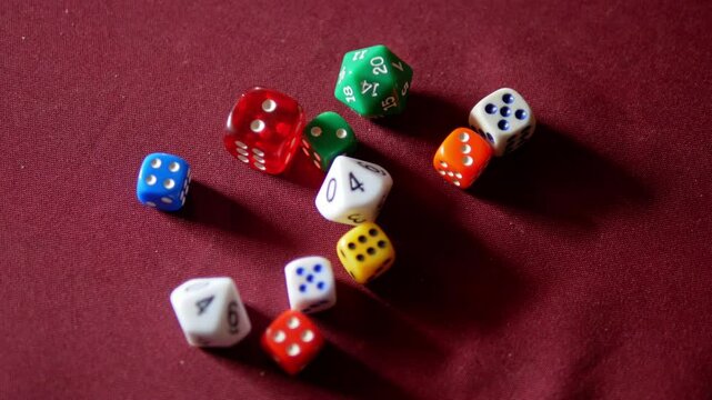 Hand throws dice on the table close-up