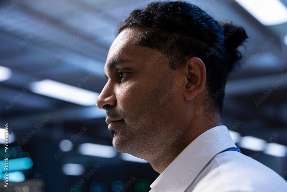 Poster it specialist walking through operational server rows in computer network security data center. main