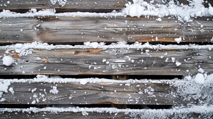 Snow covered aged wooden boards