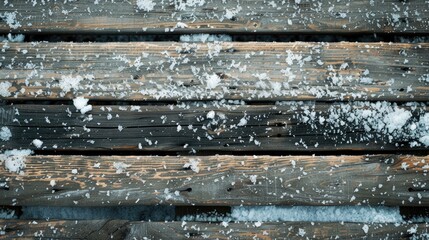 Snow covered aged wooden boards