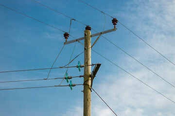 Wood telegraph pole with electricity power distribution lines and insulators