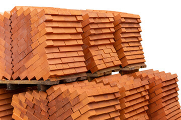 Stacks of new, red ceramic brick stacked on wooden pallets.