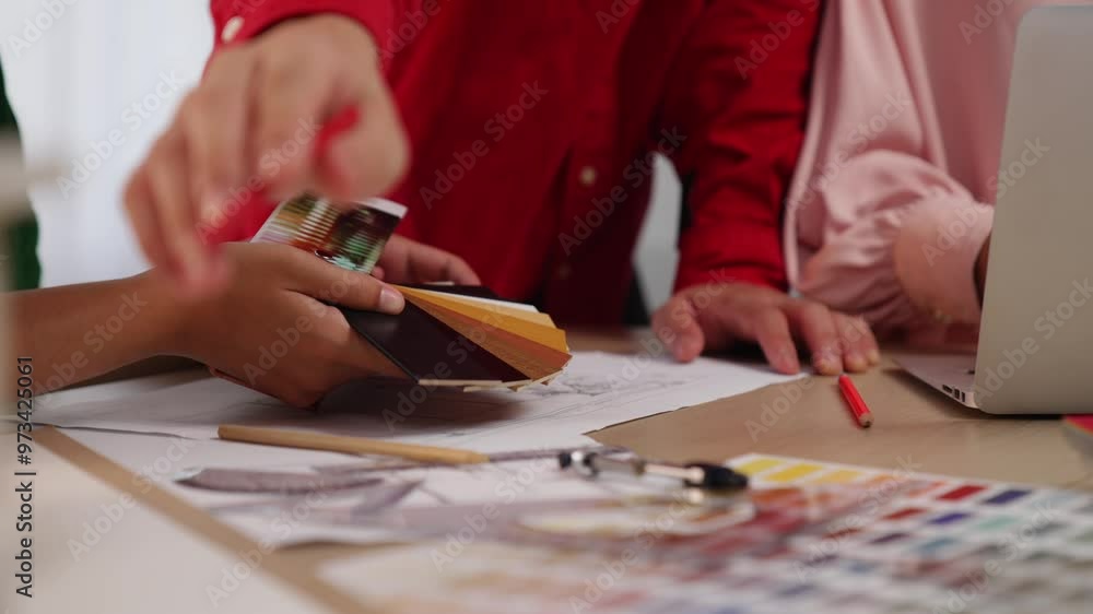 Poster slow motion hand closeup of professional architect and interior designer presenting material and col