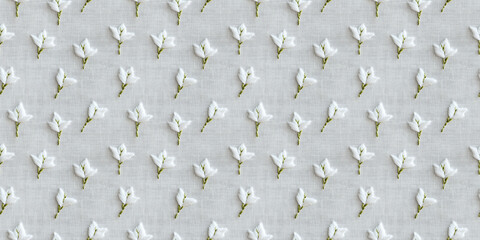 Obraz premium seamless minimalistic embroidery pattern of small white lilies, on a plain white linen