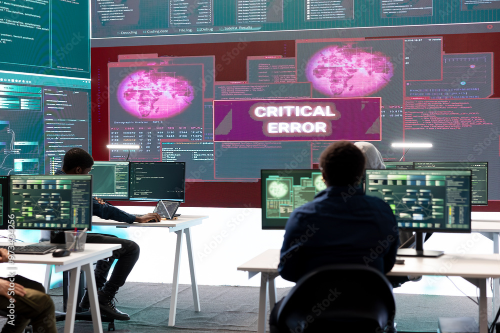 Poster it specialists receiving error messages on a big screen after trying to hack a government system, fa