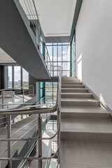 Obraz premium stairs emergency and evacuation exit stair in up ladder in a new office building