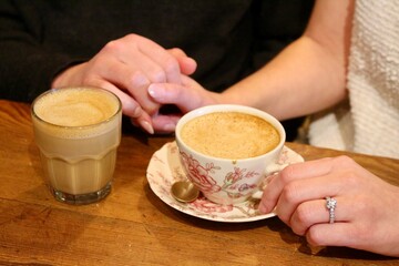 Person holding a cup of coffee