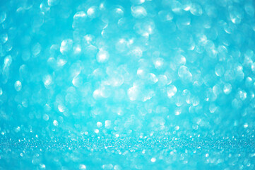 Defocus light background blue with white. Blurred glitters, sparkles shine, bokeh.