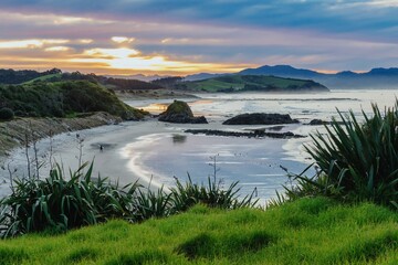 Ocean beach and waves at sunset. Tawharanui, Warkworth, Auckland, New Zealand.