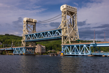 Obraz premium A Double Deck Lift Bridge In The Raised Position Crossing A River