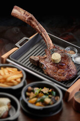tomahawk steak at dark restaurant, 