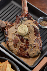 tomahawk steak at dark restaurant, 