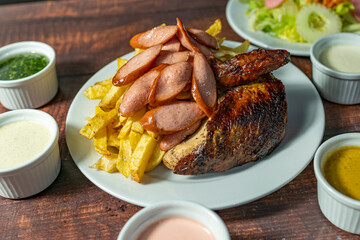 grilled chicken with french fries, fresh salad and homemade creams.