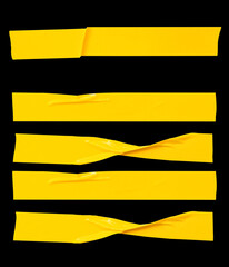 Top view set of wrinkled or crumpled yellow adhesive vinyl tape or cloth tape in stripes shape isolated on black background with clipping path