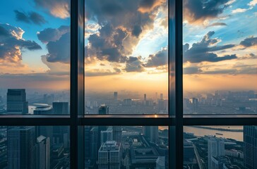 Modern cityscape seen through panoramic windows at sunset