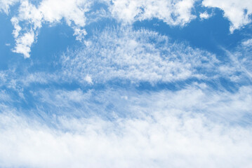 gentle white clouds in the blue sky