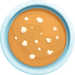 Creamy peanut butter is spread in a blue bowl, creating a delicious and visually appealing treat