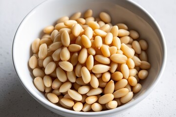 Pine Nuts Isolated on a Pristine White Background - Healthy Snack Ingredient