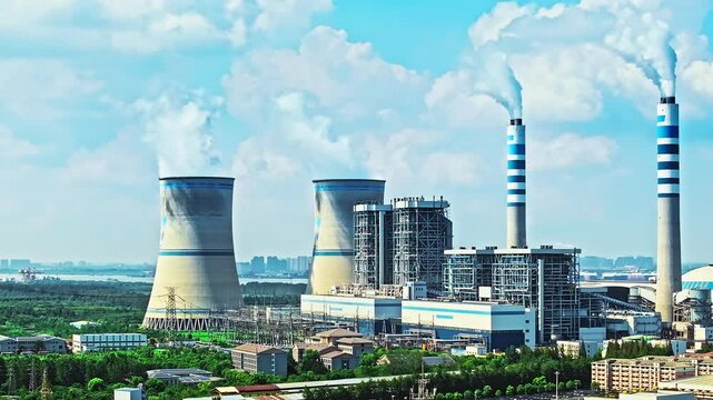 Aerial shot of thermal power station on the riverside