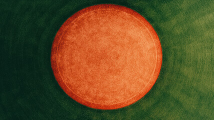 Aerial view of a vibrant red circular agricultural field set against a green landscape, showcasing unique patterns and contrast in colors.