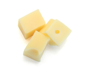 Cubes of cheddar cheese isolated on white