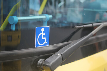 Enhancing accessibility with yellow checkerboard symbols for public transportation icon display