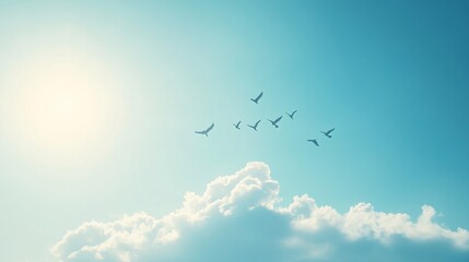 Fototapeta premium 35. Birds soaring in a V shape towards a cloud, the clear sky framing their collective journey, a beautiful display of natural coordination and direction