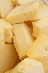 A closeup view of Yellow Cheese Pieces elegantly displayed in an appealing Culinary Setting