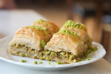Indulge in a plate of delicious Baklava filled with Pistachios that is simply irresistible