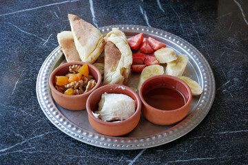 Enjoy a Delicious Breakfast Platter with Fluffy Pancakes and Healthy Fresh Fruits
