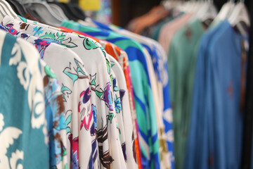 A Vibrant and Stylish Collection of Colorful Apparel is Showcased on Display Hangers