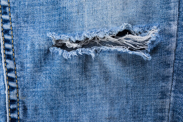 Denim pants with a tear ,ripped detail
