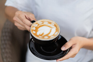 Latte Art in a Black Cup