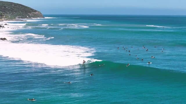 Man surfing at the beach in New Zealand