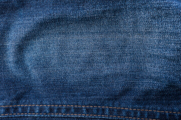 Naklejka premium An image of close-up blue denim jeans fabric showing detailed texture with a dark blue color and a stylish design backdrop