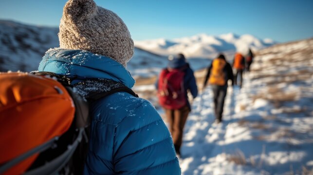Nomads Trekking Through Snowy Mountain Landscape