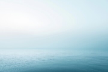 Obraz premium Minimalist seascape with fog covering the horizon on a serene day