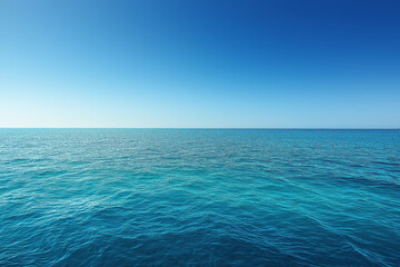 Obraz premium Deep blue ocean merging with clear sky on horizon