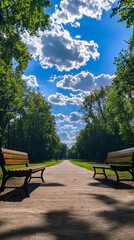 A couple of benches sitting on the side of a road in a park