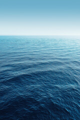 Obraz premium Deep blue ocean water surface meeting bright blue sky