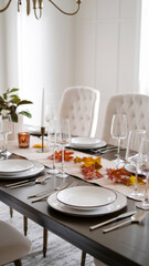 Fototapeta premium A beautifully arranged table with autumn leaves centerpieces, elegant tableware, and napkins on a white background. Concept of Thanksgiving Day dining