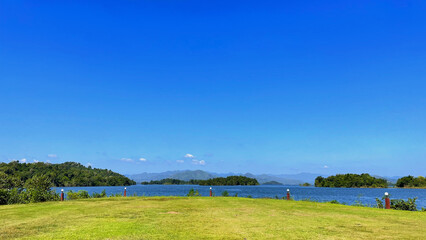 Naklejka premium A reservoir, nestled within the embrace of nature