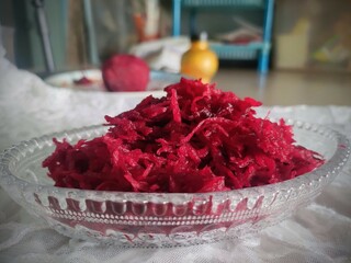 Grated beetroot in bowl.