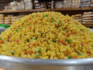 Sweet Boondi - an authentic Indian sweet dish recipe. Gram floor granules deep fried and soaked in sugar syrup. Indian Market.