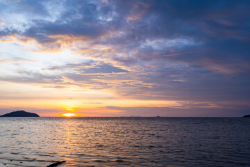 Fototapeta premium Sunset sky background,Landscape nature beautiful Light Sunset or sunrise over sea, Colorful clouds scenery sky,Amazing clouds and waves in sunset sky nature light cloud background