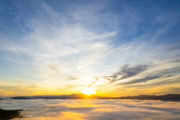 Naklejka premium Amazing Sunrise or sunset over mountains hills covered with mist, Aerial view landscape drone shot beautiful colorful nature background