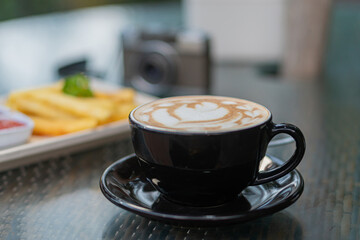 Artistic Latte in Black Cup